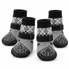 Four grey and black argyle dog grip socks with adjustable straps